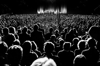 Image of an audience and stage, used in blog 7 practical ways to improve your public speaking