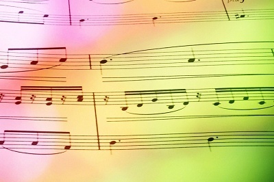 Sheet music with coloured lights, used in blog 7 practical ways to improve your public speaking