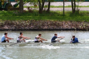 Men's rowing team practicing rowing, used in the blog 4 lessons rowing can teach us about productivity management